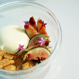 Thermic Sublime Double Wall Dessert Bowl filled with appetizing dessert with figs and cookies finished with little flowers and gold flakes, standing on a white surface