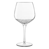 A clear crystal gin and tonic old tom gin glass with a geometric pattern at the bowl's base, designed for serving gin and tonic on a white background