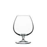 A clear, round, Vinoteque Cognac glass with a wide bowl and short stem designed for serving cognac or spirits, made from high-tech crystal glass on a white background