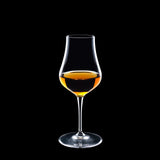 Vinoteque Snifter glass filled with a spirit on a black background