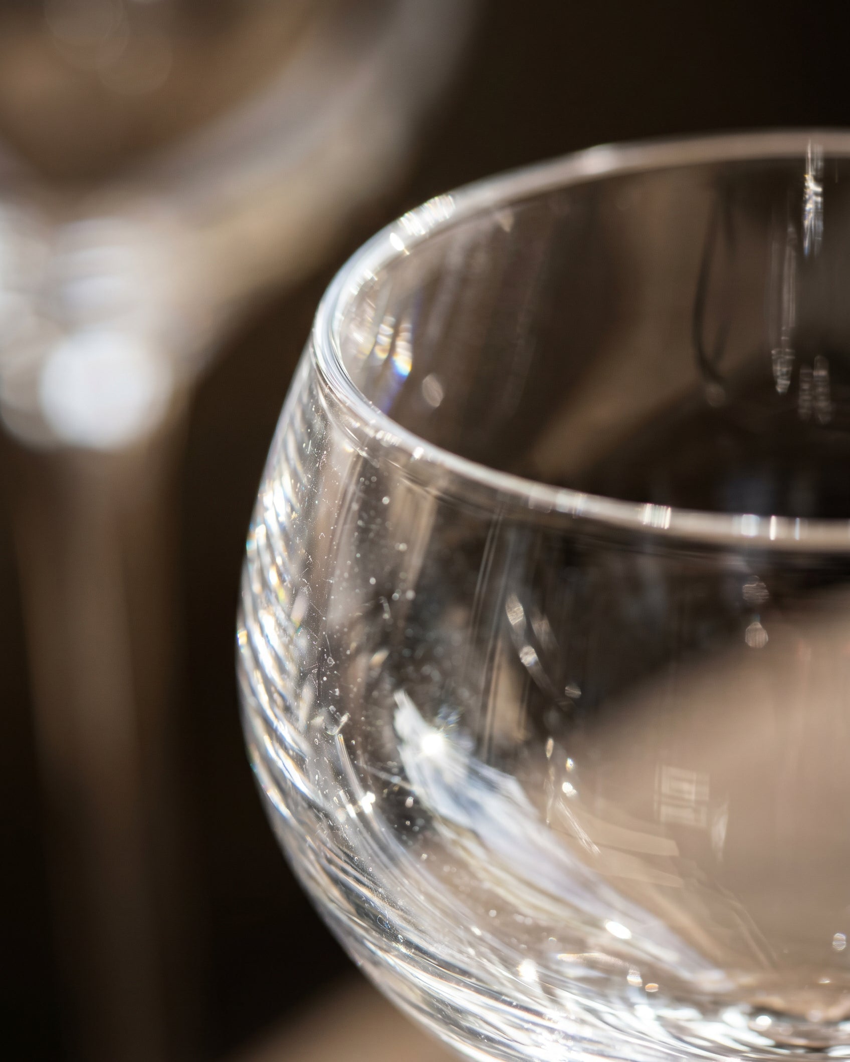 Close-up of a clear glass with a blurred background