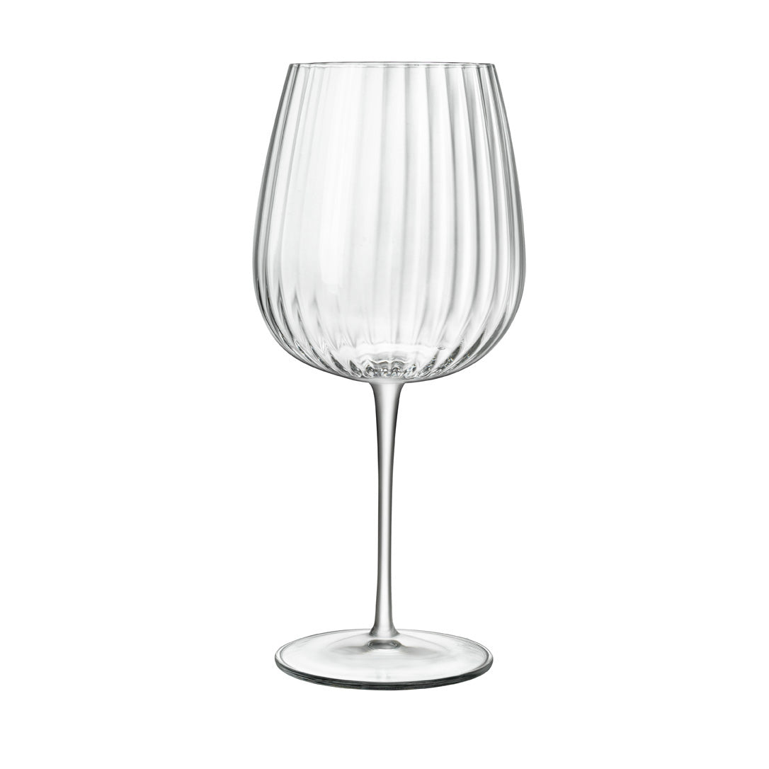 A clear, sophisticated Jenever Gin glass with vertical ridges, featuring a thin stem and flat foot on a white background