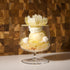 Delicate dessert in a glass dish with floral elements against a wooden background